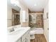 Tiled bathroom with a shower and tub combination, complemented by a sleek vanity and modern fixtures at 2585 Constance Ct, The Villages, FL 32163