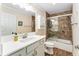 Bathroom with a shower and tub combination, complemented by a sleek vanity and modern fixtures at 2585 Constance Ct, The Villages, FL 32163