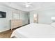 Bright bedroom with a dresser and entrance into the bathroom at 2585 Constance Ct, The Villages, FL 32163