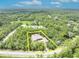 A yellow perimeter surrounds a property in this high angle shot featuring mature vegetation at 30342 Vitex Ave, Eustis, FL 32736
