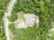 Straight-down aerial of the home including the unique roof and the meticulously tended surrounding lawns at 30342 Vitex Ave, Eustis, FL 32736