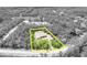 Property lines are shown in this aerial photograph of a home in a wooded area at 30342 Vitex Ave, Eustis, FL 32736