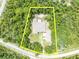 Property line outlined of a home secluded within flourishing greenery, offering an idyllic retreat at 30342 Vitex Ave, Eustis, FL 32736