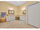 Bright bathroom features double vanities, white cabinetry, and a linen closet at 30342 Vitex Ave, Eustis, FL 32736