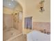 Bright bathroom featuring a luxurious walk-in shower, a tub and elegant tile work at 30342 Vitex Ave, Eustis, FL 32736