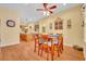 Bright dining area with hardwood floors and a wooden table perfect for Gathering meals at 30342 Vitex Ave, Eustis, FL 32736