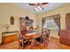 Traditional dining room with hardwood floors and a large wooden dining table at 30342 Vitex Ave, Eustis, FL 32736