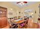 Dining room featuring hardwood floors, a large wooden dining table, and comfortable seating at 30342 Vitex Ave, Eustis, FL 32736