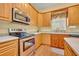 Well-equipped kitchen with stainless steel appliances and ample counter space for meal preparation at 30342 Vitex Ave, Eustis, FL 32736
