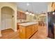 Bright kitchen boasts a large island with pendant lighting and a view into the dining area at 30342 Vitex Ave, Eustis, FL 32736