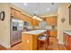 Modern kitchen with an island, stainless steel refrigerator, and ample cabinet space at 30342 Vitex Ave, Eustis, FL 32736