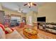 Spacious living room featuring natural light, wood floors and comfortable seating at 30342 Vitex Ave, Eustis, FL 32736