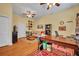 Open living area with hardwood floors, ceiling fans, with adjacent office at 30342 Vitex Ave, Eustis, FL 32736