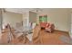 Covered patio area with ceiling fans, table, chairs, and comfortable seating at 30342 Vitex Ave, Eustis, FL 32736