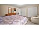 Bedroom with soft carpet, large bed, closets, and dresser at 31136 Senese Rd, Sorrento, FL 32776