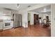 Kitchen with stainless steel refrigerator, gas range, and wood flooring at 31136 Senese Rd, Sorrento, FL 32776