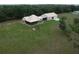 Spacious country home featuring a large lawn and detached garage/workshop at 3147 Rambler Ave, St Cloud, FL 34772