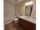 Bathroom featuring shower/tub combo, vanity, toilet, and vinyl floors at 3147 Rambler Ave, St Cloud, FL 34772