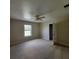 Bedroom featuring neutral walls, carpet, ceiling fan, and natural light at 3147 Rambler Ave, St Cloud, FL 34772
