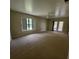 Bedroom featuring neutral walls, carpet, ceiling fan, and natural light at 3147 Rambler Ave, St Cloud, FL 34772