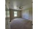 Comfortable bedroom features carpet flooring and a bright, inviting atmosphere at 3147 Rambler Ave, St Cloud, FL 34772