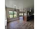 Open dining area with wood-look floors and views of the landscaped yard at 3147 Rambler Ave, St Cloud, FL 34772