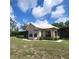 Lovely brick home with a screened porch surrounded by lush landscaping at 3147 Rambler Ave, St Cloud, FL 34772