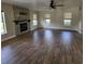 Spacious living area with fireplace and wood-look flooring, perfect for gatherings at 3147 Rambler Ave, St Cloud, FL 34772