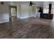 Open-concept living room boasts new wood flooring and abundant natural light at 3147 Rambler Ave, St Cloud, FL 34772