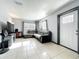 Cozy living room with neutral tones, comfortable seating, tile floor and a bright, airy feel at 326 N Lancelot Ave, Orlando, FL 32835