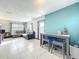 Open living room with tile flooring, modern furnishings, and a charming adjacent dining area at 326 N Lancelot Ave, Orlando, FL 32835