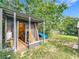 Open shed adjacent to backyard with tools, netting, and building supplies at 326 N Lancelot Ave, Orlando, FL 32835