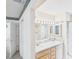 Bathroom featuring double sinks, vanity lighting, and a separate shower at 32701 Timberwood, Leesburg, FL 34748