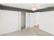 Bedroom featuring closet, neutral carpet, and doorways at 32701 Timberwood, Leesburg, FL 34748