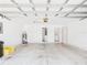 Spacious garage with water heater, door, and utility closet at 32701 Timberwood, Leesburg, FL 34748