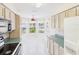 Charming kitchen with a breakfast nook featuring windows that provide lots of natural light and garden views at 32701 Timberwood, Leesburg, FL 34748