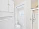 Bathroom featuring toilet, cabinet, and shelving for storage at 32701 Timberwood, Leesburg, FL 34748