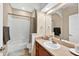 Bathroom featuring bathtub with shower, single sink vanity, neutral walls, and carpet floors at 33316 Irongate Dr, Leesburg, FL 34748