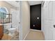 Well-lit bathroom featuring a tiled shower and built-in shelving at 33316 Irongate Dr, Leesburg, FL 34748