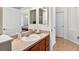 Bathroom featuring single sink vanity, neutral walls, and views of two other rooms at 33316 Irongate Dr, Leesburg, FL 34748