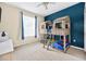 Bedroom features unique bunk beds, neutral carpet, and large window for natural light at 33316 Irongate Dr, Leesburg, FL 34748