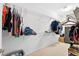 Walk-in closet provides ample storage with shelving and plenty of room for shoes and clothes at 33316 Irongate Dr, Leesburg, FL 34748