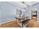 Bright dining room with a modern light fixture and seating for six at 33316 Irongate Dr, Leesburg, FL 34748