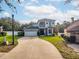 Two-story home with a well-kept lawn at 33316 Irongate Dr, Leesburg, FL 34748