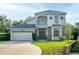 Charming two-story home featuring a well-manicured front yard at 33316 Irongate Dr, Leesburg, FL 34748