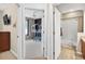 Hallway featuring a bathroom and a bedroom with a bunkbed with the bathroom at the end of the hall at 33316 Irongate Dr, Leesburg, FL 34748