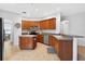 Well-lit kitchen with stainless steel appliances, ample cabinet space, and a convenient island, perfect for cooking at 33316 Irongate Dr, Leesburg, FL 34748