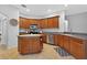 Well-lit kitchen with stainless steel appliances, ample cabinet space, and a convenient island, perfect for cooking at 33316 Irongate Dr, Leesburg, FL 34748