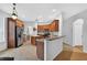 Open-concept kitchen featuring dark wood cabinets and stainless steel appliances at 33316 Irongate Dr, Leesburg, FL 34748
