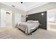Relaxing bedroom featuring neutral tones, a decorative headboard, with a view of the ensuite at 33316 Irongate Dr, Leesburg, FL 34748